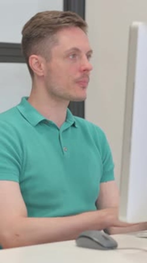 Mature Adult Man Leaving Office after Working on Desktop Computer