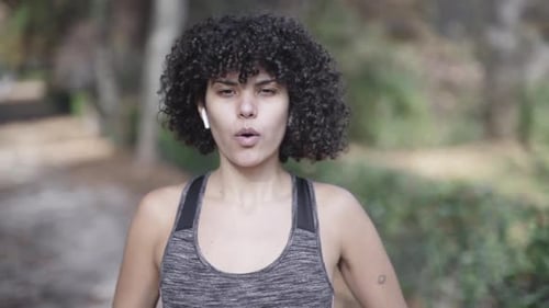 Warming up breathing exercises by a girl in curls