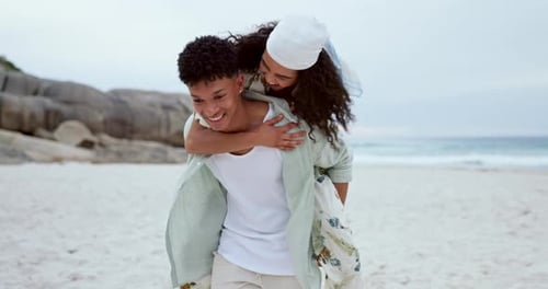 Couple, smile and piggy back at beach for love, care and romantic holiday