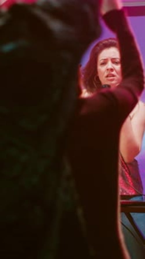 Singer Performing at a Party with a Microphone