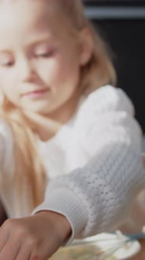 Charming Girl Cut Add Green Salad and Whipping Chicken Eggs with a Hand Mixer for Cooking Stand in