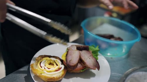 Burger Being Prepared in Restaurant Kitchen