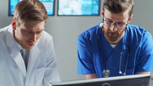 Professional Medical Doctors Working in Hospital Office Using Computer Technology Medicine