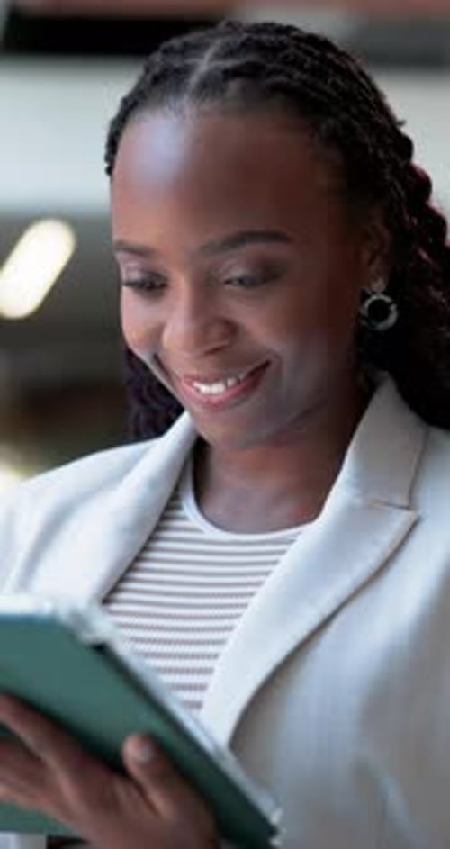 Happy, business and black woman with tablet in office for research, email editor and story approval