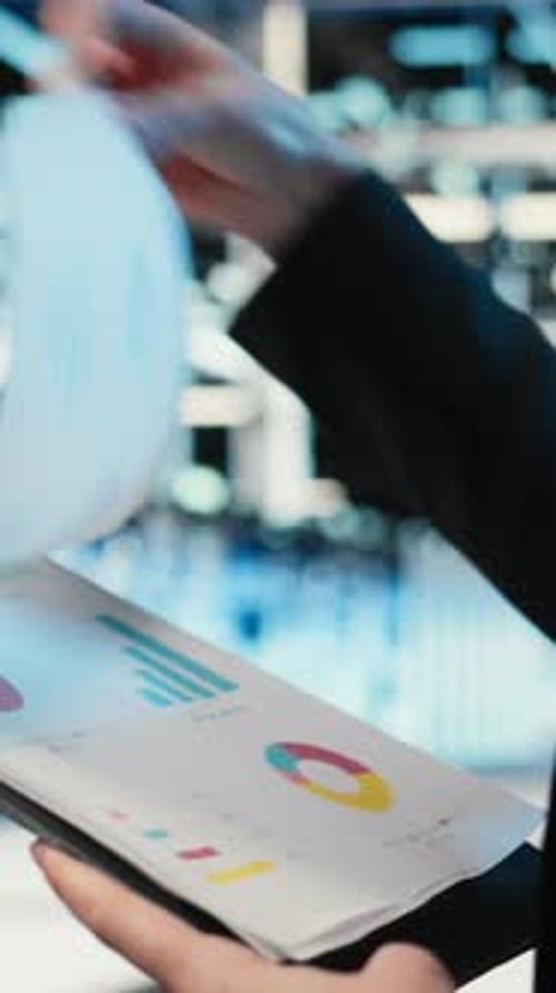 Vertical Video Data Center Admin Verifying Infrastructure Status with Clipboard Files Closeup