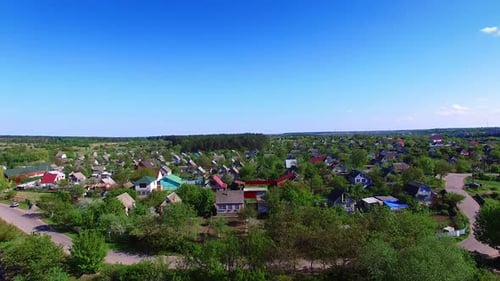 Quite big village with beautiful cottages among the green trees.