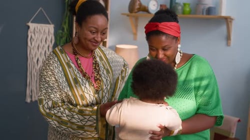 Loving Family Moment Indoors with Smiling Women