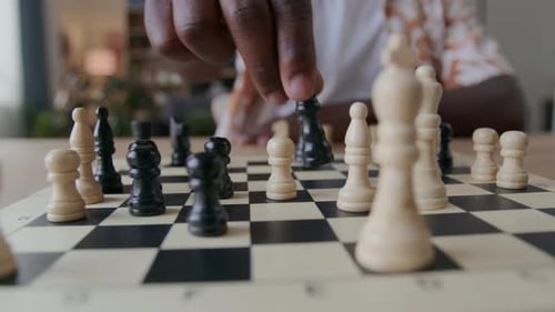 Man Playing Chess at Table, Close Up