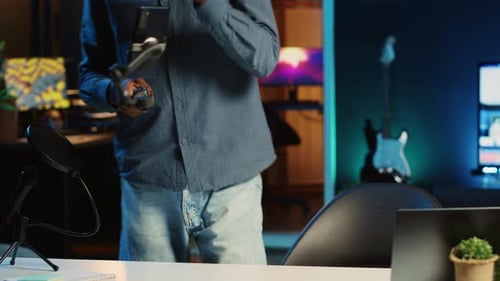 Man Video Chatting in Home Recording Studio