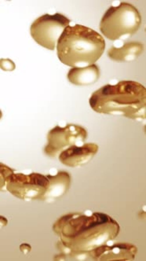 Fluid Golden Bubbles Flowing Upwards Abstract Background