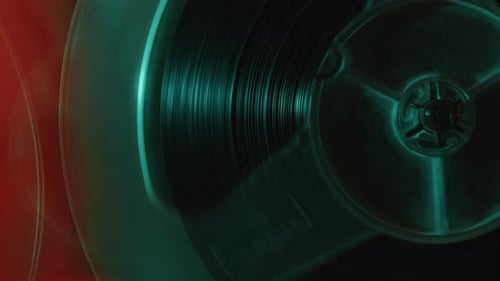 Rotating Reel Tape of Analog Tape Recorder Playing the Music