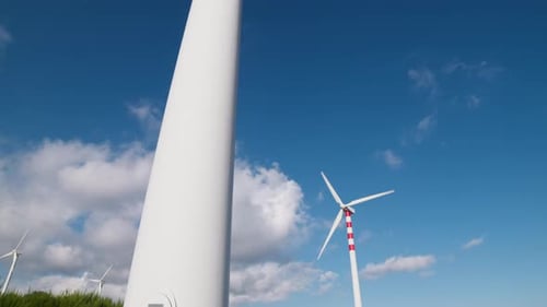 Wind Turbines Spinning on Sunny Day, Blue Sky