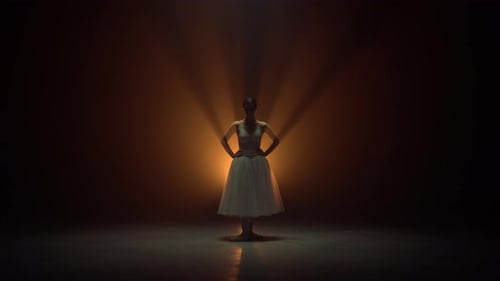 Ballerina Posing in Studio with Backlight
