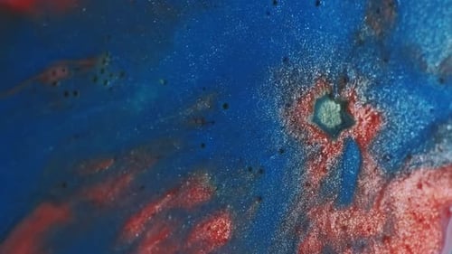 Shimmering, Glimmering, and Abstract Red and Blue Liquid