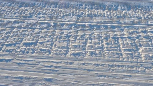 Aerial View Of Snowboarding Trails During Daytime