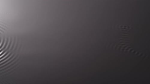 Water Surface Monochrome Light Creating Circles and Ripples Under Ultra Sound Vibrations Abstract