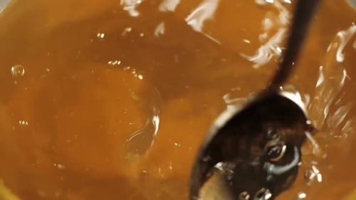 Tea ceremony. Spoon stirs tea in a teapot. Modern cold Chinese ceremony. Close up. View from up