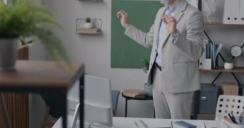Businessperson Using Virtual Reality Glasses Moving Hands Standing in Office Enjoying Work Break
