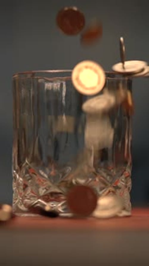 Stylish Bar Scene with a Whiskey Glass and Floating Coins Creating a Unique Ambiance