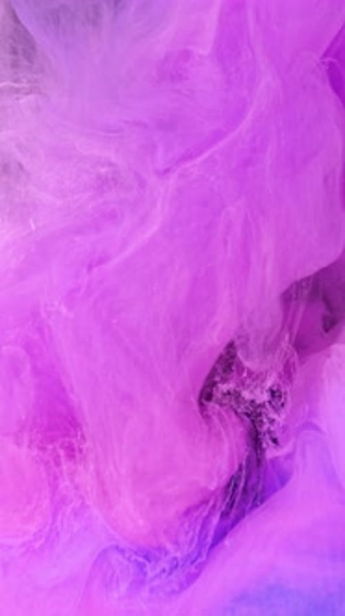 Magenta and Purple Ink Swirls Abstractly