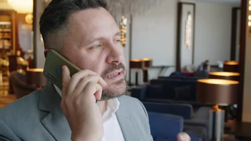 Entrepreneur Talking on Smartphone with Partner