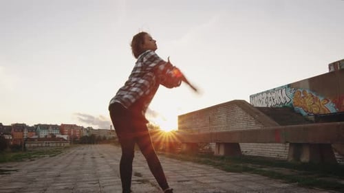 Young Teenager Girl Performing Modern Dance on Abandoned Building.