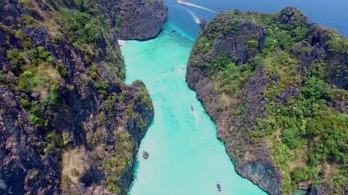 Aerial view of iconic tropical turquoise water Pileh Lagoon surrounded by limestone cliffs, Phi Phi