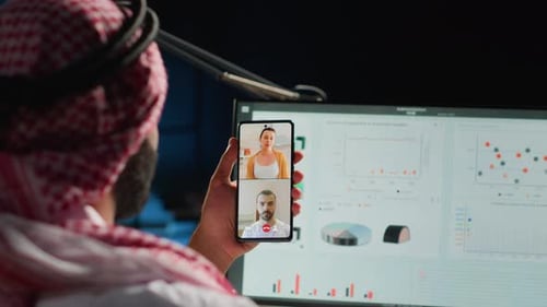 Man Has Video Call in Workplace at Night