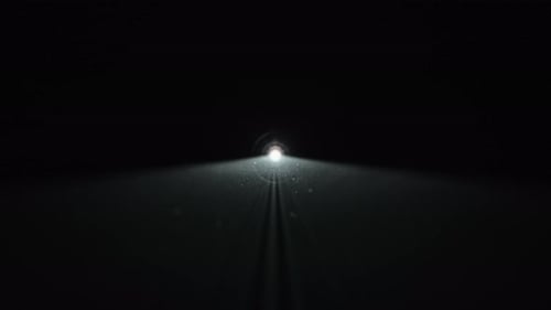 White Light Beam Of A Projector In Darkness