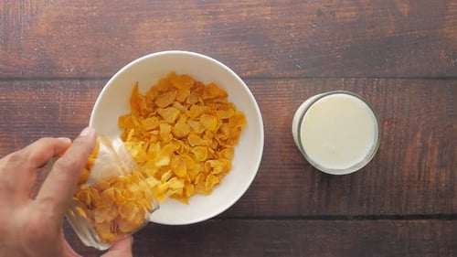Top View of Corn Flakes Drops in a Bowl on Table