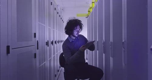 Young Adult Working in Modern Server Room
