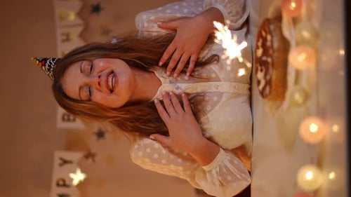Woman Celebrates Birthday with Cake and Sparkler