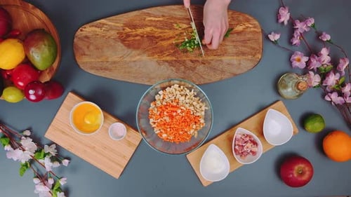 Chopping Green Onions on a Cutting Board