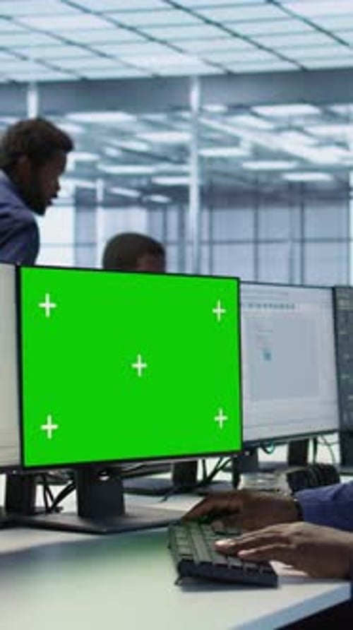 Vertical Video Engineer Using Green Screen Computer Working in Server Farm