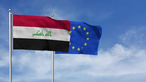 Iraq and European Union Flags Waving Against Blue Sky