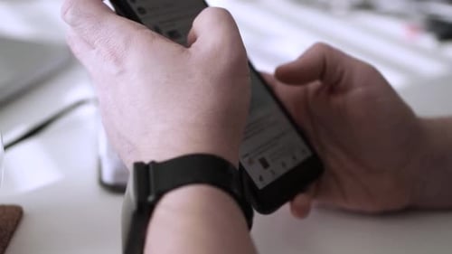 Man scrolling social media in smartphone