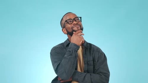 Thinking, idea and young black man in a studio with a problem solving, brainstorming
