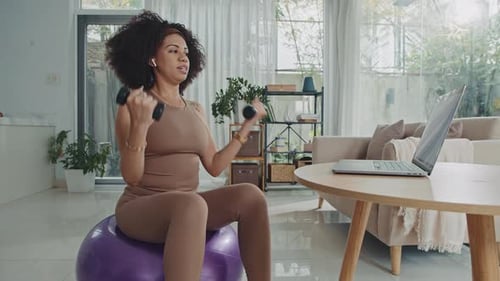 Woman Working Out with Dumbbells at Home