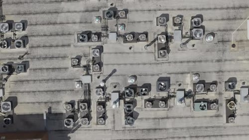 Big Industrial HVAC Air Conditioner System on the Roof Drone Top Down View