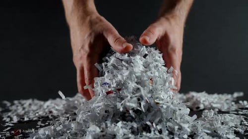 Shredded Paper Office Documents in Worker Man Hands Close Up