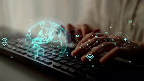 Hands Typing on Keyboard with Digital Globe and Technology Icons Representing Global Communication a