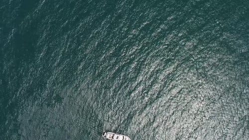 Aerial Yacht on Calm Sea Luxury Cruise Trip View From Above of White Boat on Deep Blue Water Aerial