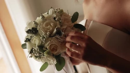 Elegant Bride Holding White Floral Bouquet Indoors