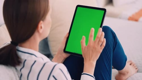 Woman Uses Tablet with Green Screen at Home