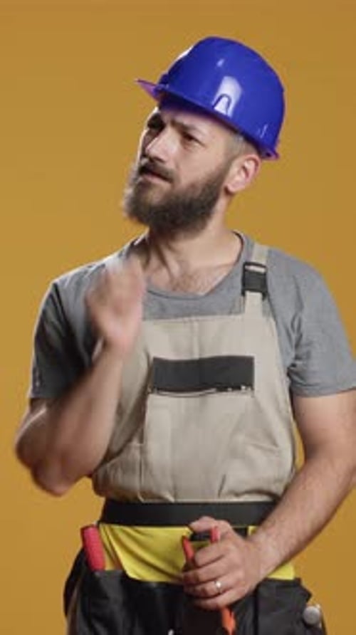 Vertical Video Construction Worker Brainstorming Ideas to Work on Rebuilding
