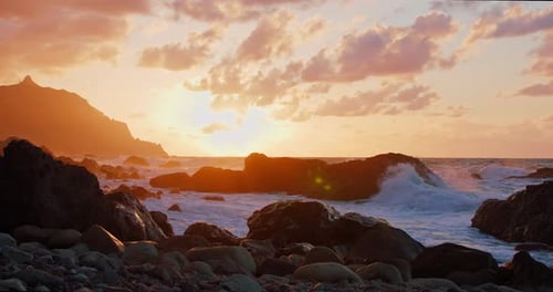 Foaming Ocean Waves Crashing Against Stone Rock Cliffs at Tenerife North Coast