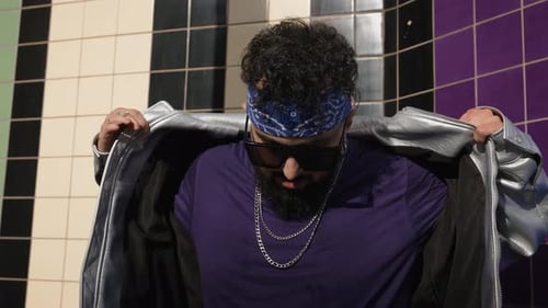 Confident Young Man Adjusting Trendy Jacket