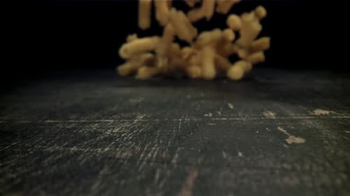 Dry Pasta Falls on the Table Filmed on a Highspeed Camera at 1000 Fps