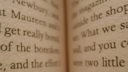 Inside the Books Macro Camera Moving Close Up of English Texts on Book Sheets Macro Shot Moves