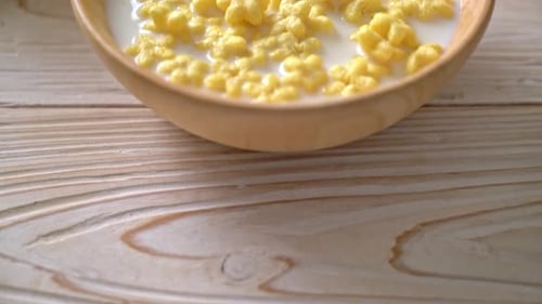 Cereal and Milk in a Wooden Bowl